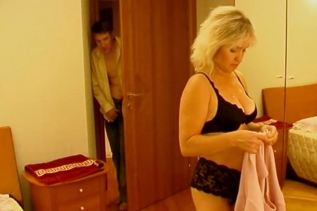 The guy was jerking off on his mom and forced her to fuck on a nightstand.